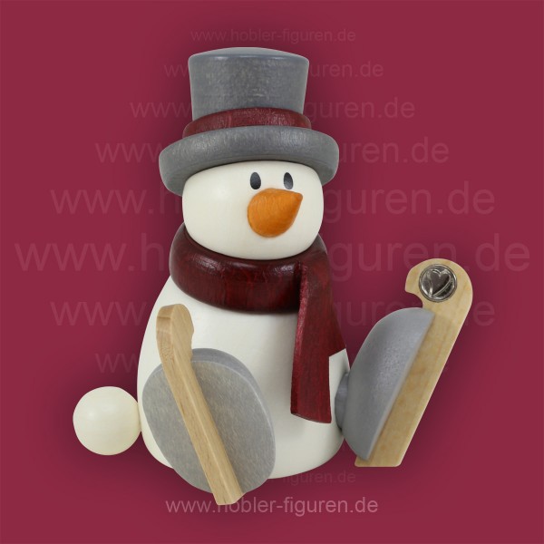 Schneemann Otto sitzend mit Schlittschuh